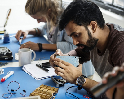 two technicians fixing gadgets